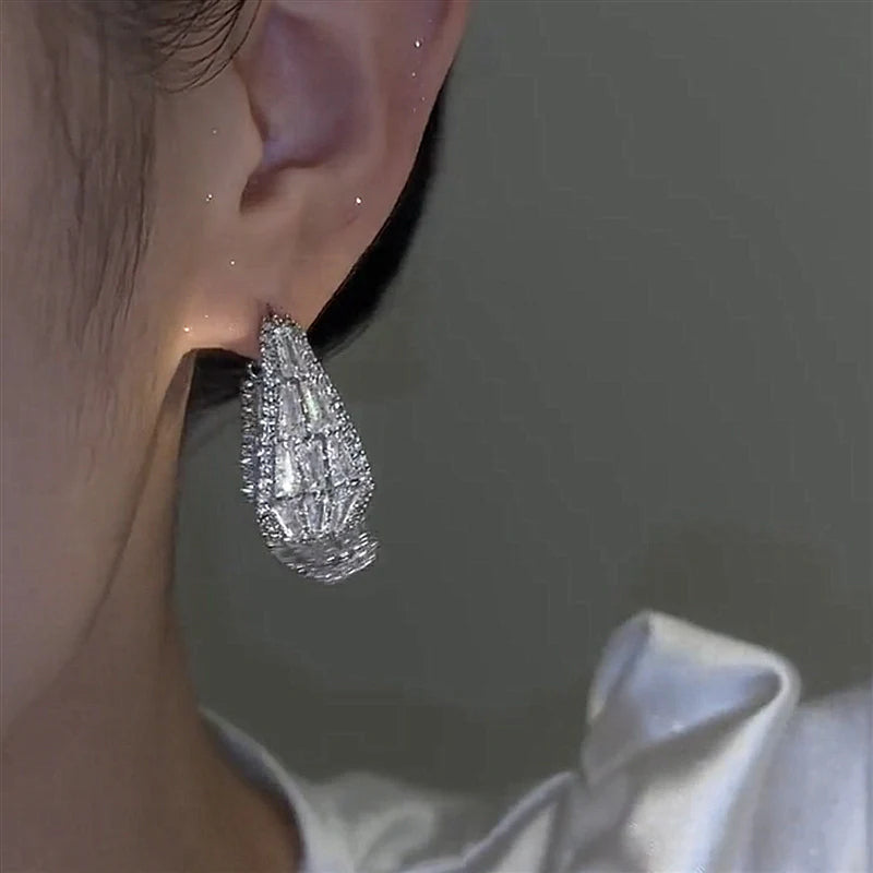 Boucles d'oreilles scintillante double face